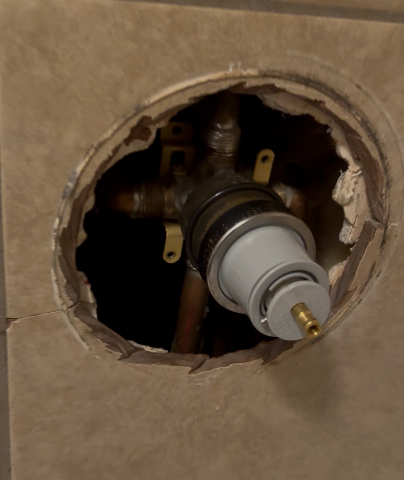 Plumbing fixture installation showing a valve inside a wall cavity, highlighting Edge Plumbing's services in Glendale, AZ.