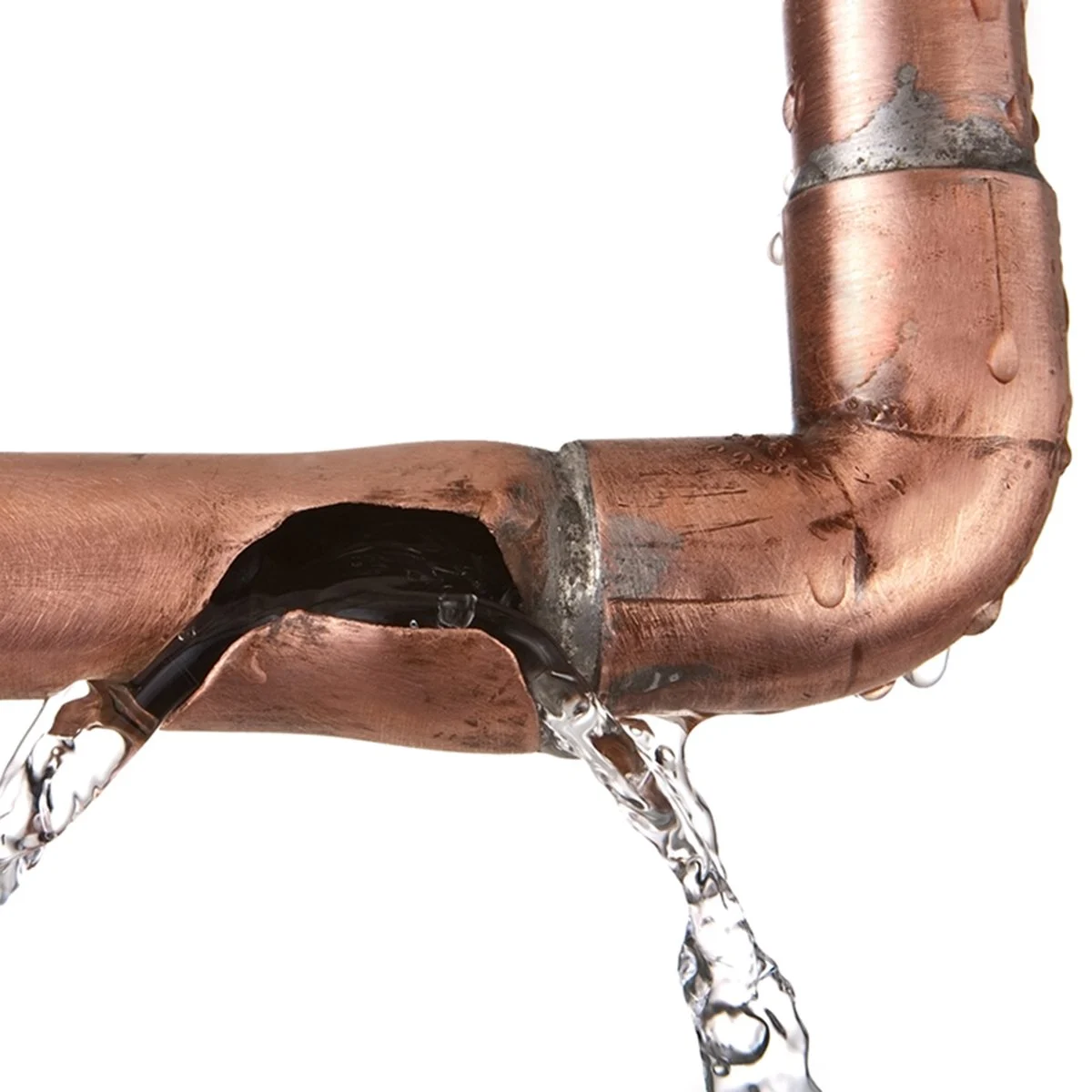 Copper pipe with a visible crack leaking water, illustrating potential plumbing issues related to colder temperatures.