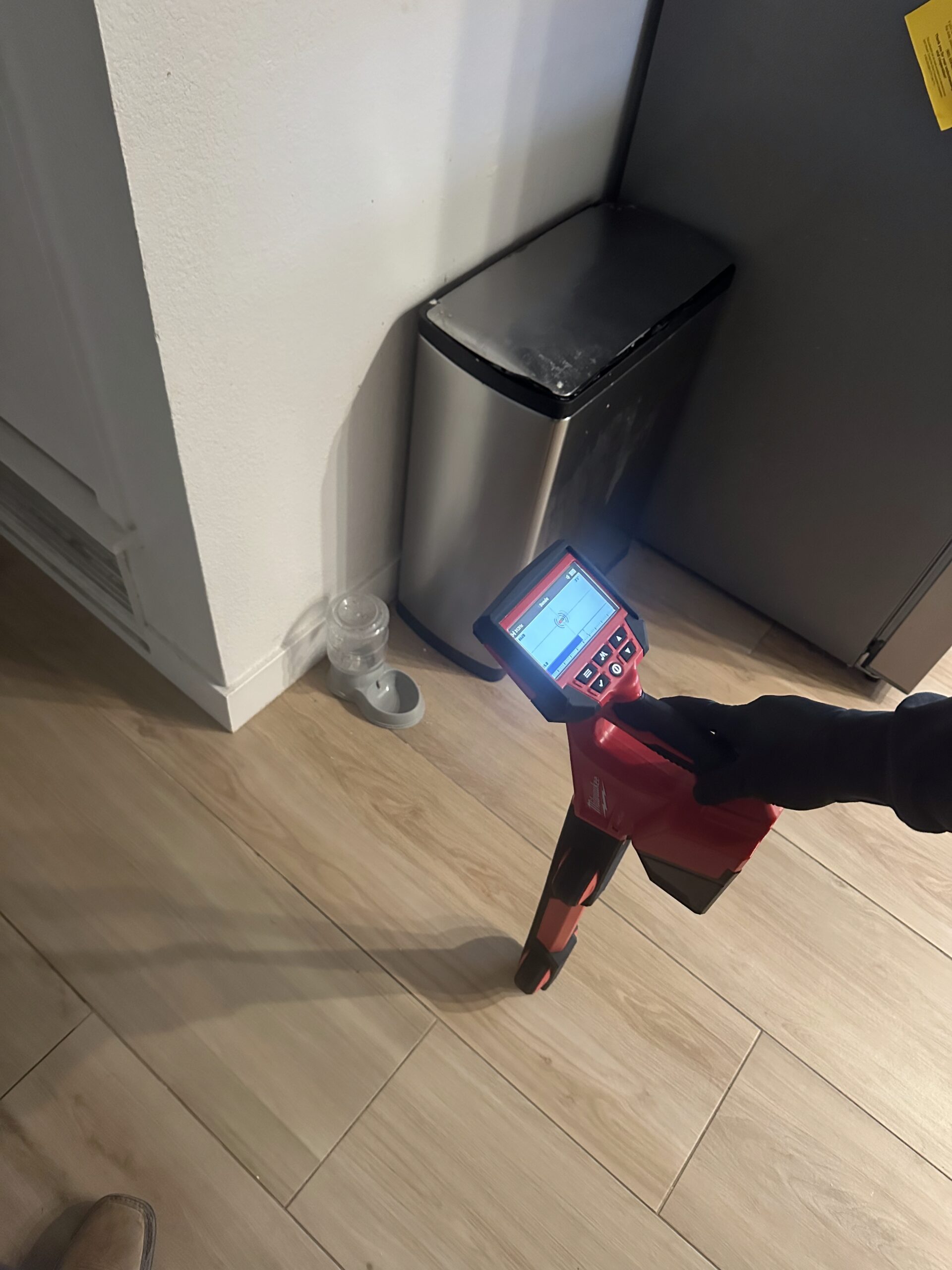 Sewer line locating device in residential setting, showcasing advanced technology for identifying sewer issues, relevant to Edge Plumbing's services in West Valleys, AZ.